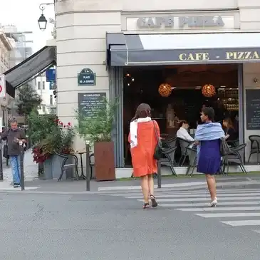Two women crossing the street in Paris